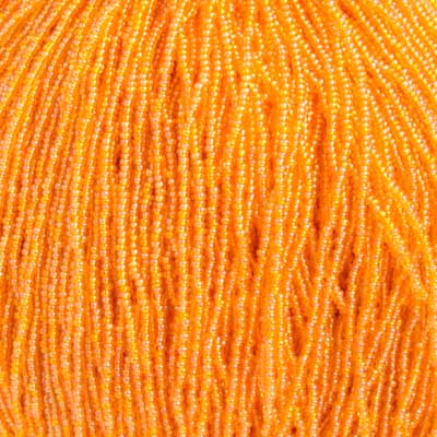 Czech Seed Bead 11/0 Transparent Light Orange AB Strung image