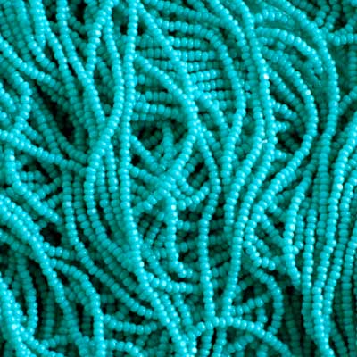 Czech Seed Bead 13/0 Cut Opaque Turquoise Strung image