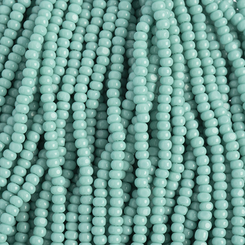 Czech Seed Bead 11/0 Cut Opaque Turquoise Strung image