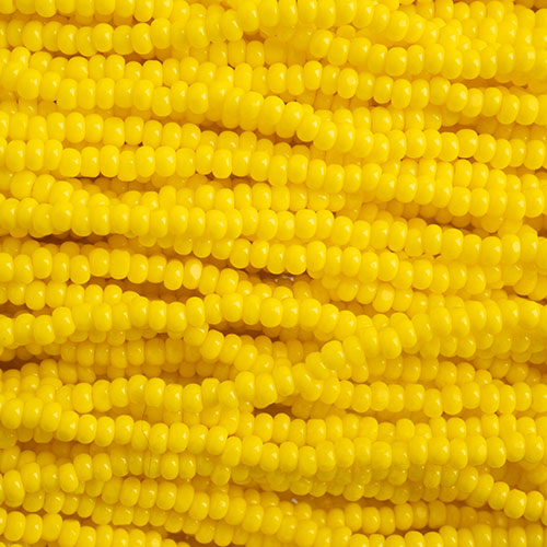 Czech Seed Bead 11/0 Cut Opaque Lemon Yellow Strung image